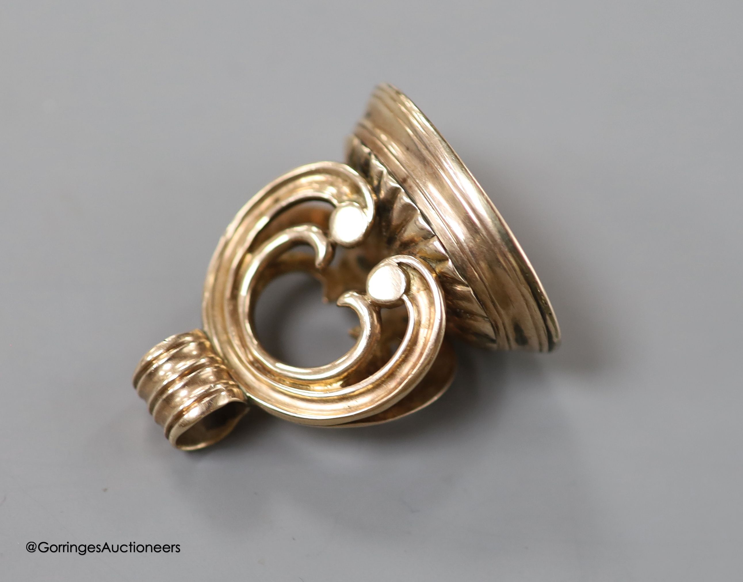 A 19th century yellow metal overlaid and chalcedony set oval fob seal, with monogrammed matrix, 37mm, gross weight 18.6 grams.